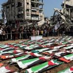 فلسطينيون يشيّعون 112 شهيداً بعد إنتشالهم بمدينة غزة