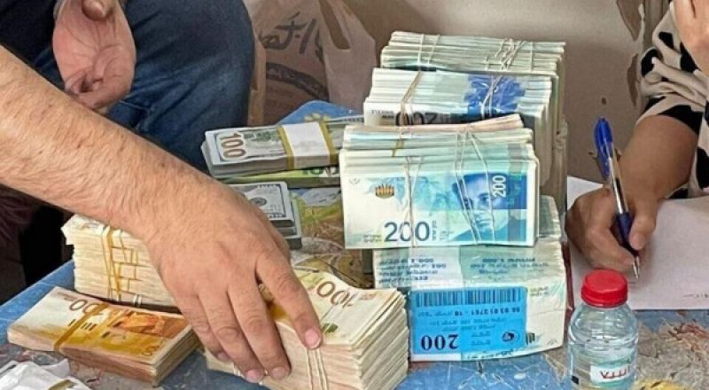 الشرطة تضبط أموالاً وأسلحة بمدن بالداخل المحتل